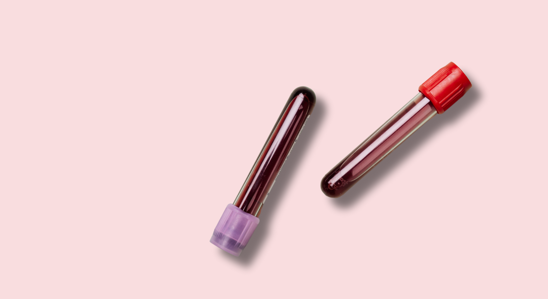 blood test tubes on a pink background