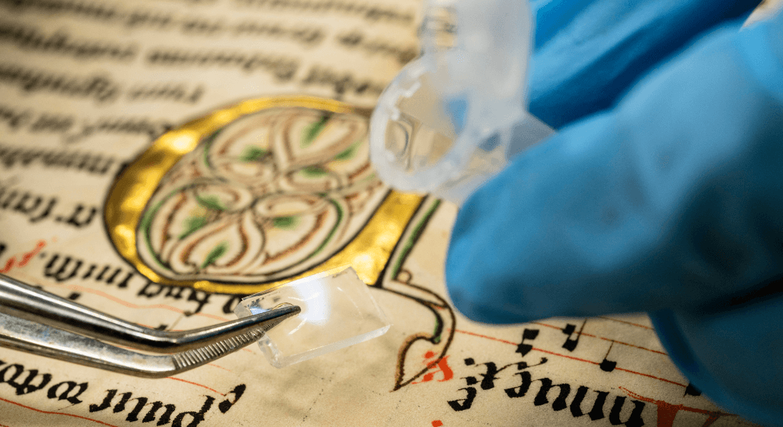 Original medieval text being examined